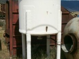 5ft diameter x 5ft deep fiberglass tank. On support legs.