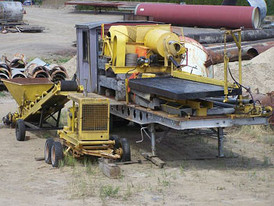Placer/Tailings pilot plant. Trommel and ball mill, plus full size concentrating table. All on 35 foot highboy trailer. Complete with feed conveyor and generator
