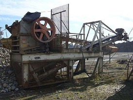 Used Telsmith Jaw Crusher. 15 in. x 38 in. 60 HP Motor & 36 in. Discharge Conveyor. All Mounted on Common Frame.